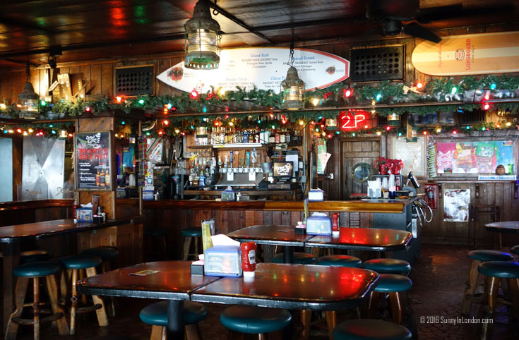 Eating Gator Bites at Ocean Deck, a beach bar in Daytona Beach, Florida