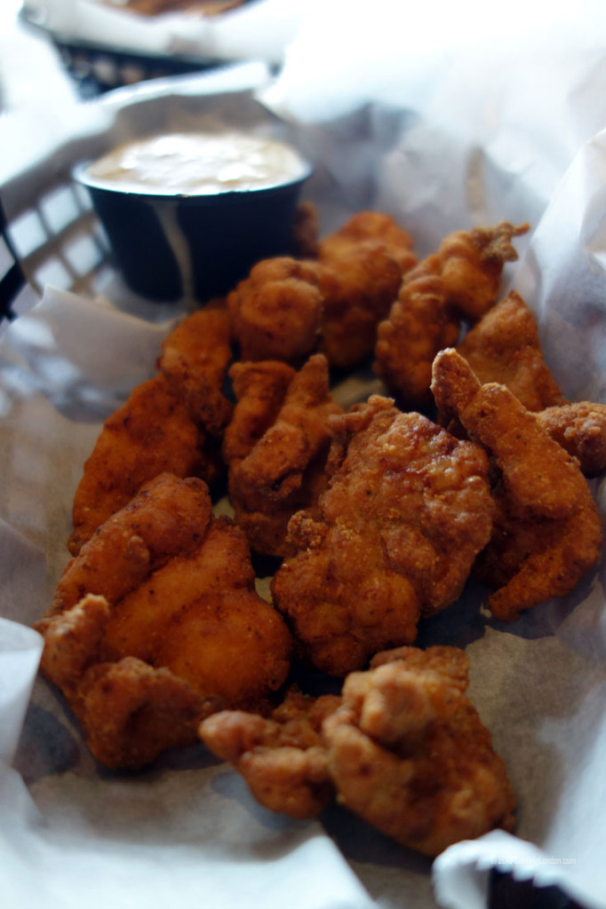 Eating Gator Bites at Ocean Deck, a beach bar in Daytona Beach, Florida